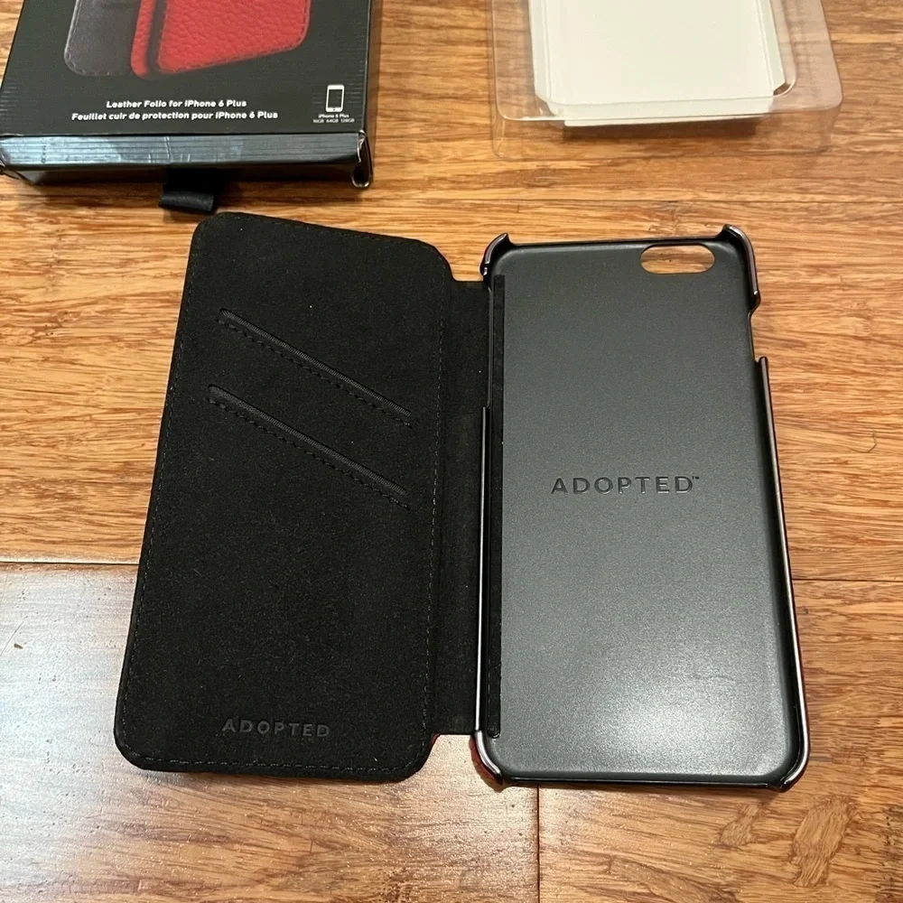 ADOPTED Iphone 6 Plus red pebbled leather folio case w/ card slots. Original Box